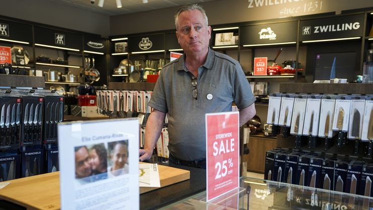 Zwilling Factory Store manager Marcus Kergosien looks out from his shop behind a small...