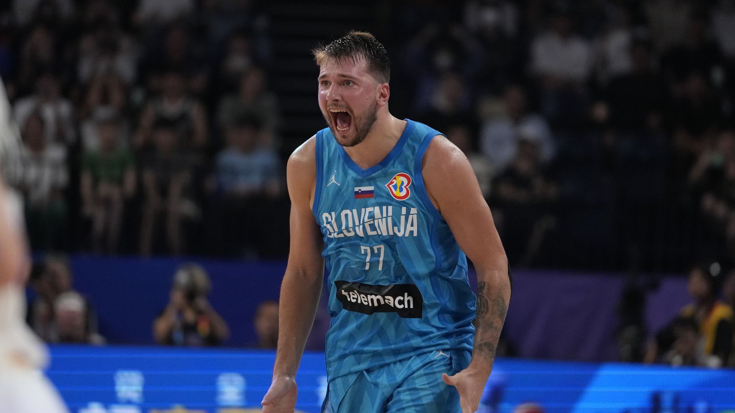 Slovenia guard Luka Doncic (77) reacts during the first half of a Basketball World Cup Group...